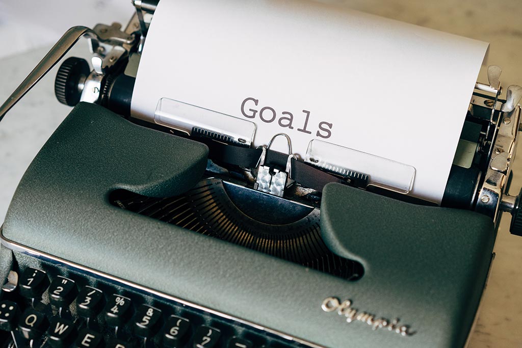 Máquina de escrever com palavra “Goals”